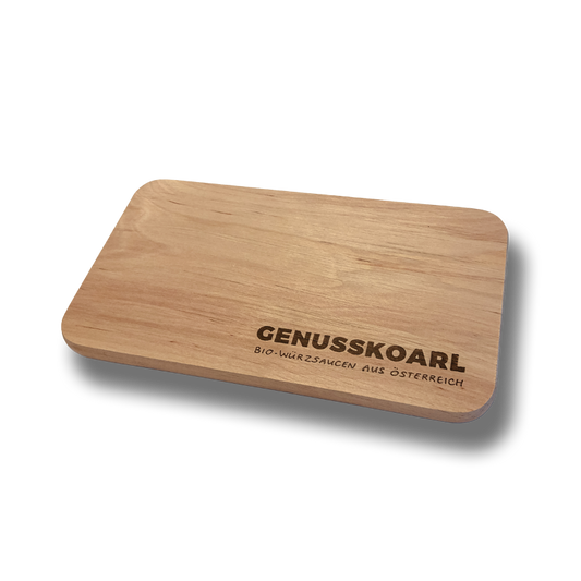 Schneidebrett aus Holz mit Genusskoarl-Logo